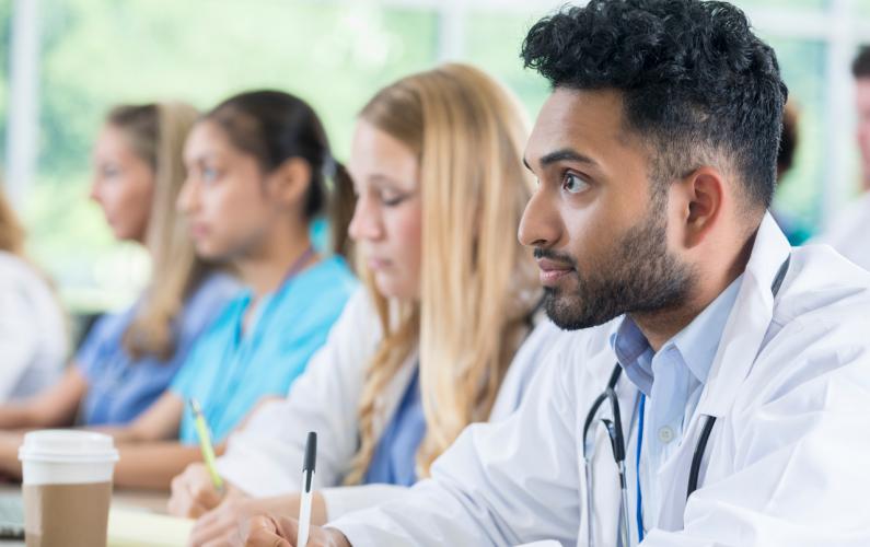 Medical students taking notes