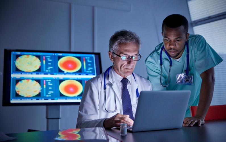A photograph of two physicians researching