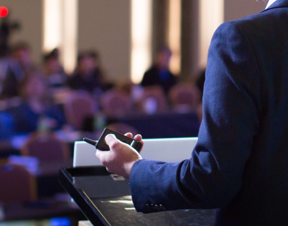 man presenting in front of audience